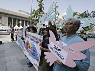 Protesters shout slogans during a rally demanding to stop the US-South Korean joint military exercises