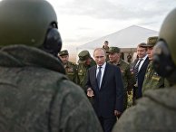 Russian President Vladimir Putin meets with officers after military exercises at Donguz range in Russia