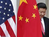 Chinese President Xi Jinping steps out from behind China's flag as he takes his position for his joint news conference with President Barack Obama