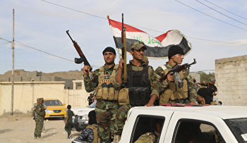 Sunni volunteer fighters parade as they prepare to support Iraqi security forces in liberating the city of Ramadi from Islamic State group militants