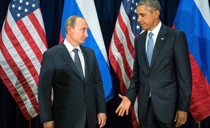 U.S. President Barack Obama, right, and Russia's President Vladimir Putin pose for members of the media before a bilateral meeting