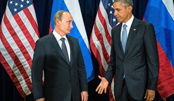 U.S. President Barack Obama, right, and Russia's President Vladimir Putin pose for members of the media before a bilateral meeting