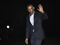 President Barack Obama waves as he walks off of Marine One on the South Lawn of the White House in Washington