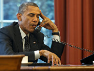 President Barack Obama listens during a phone call at the White House