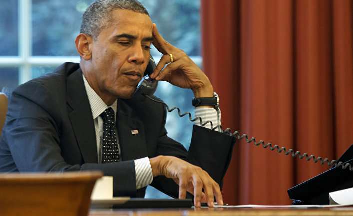 President Barack Obama listens during a phone call at the White House