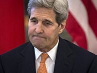 U.S. Secretary of State John Kerry takes his seat for a meeting in Vienna, Syria Talks
