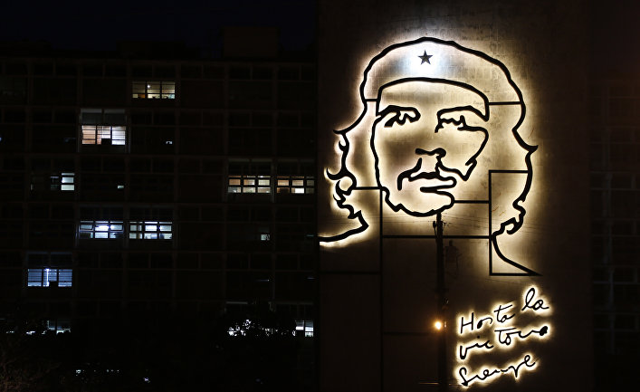 Some office lights are left on at the Ministry of Interior, decorated with an iron sculpture of Cuba's revolutionary hero Ernesto "Che" Guevara at Revolution Square in Havana, Cuba