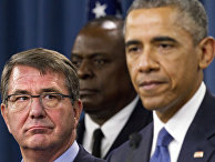 Defense Secretary Ash Carter, left, looks at President Barack Obama as the president speaks to the media after receiving an update from military leaders on the campaign against the Islamic State