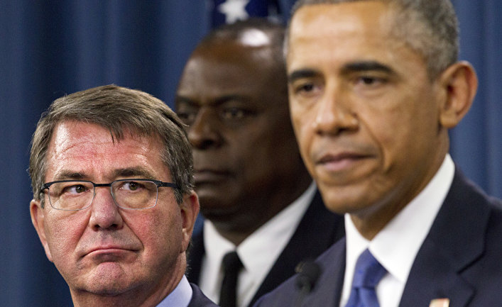Defense Secretary Ash Carter, left, looks at President Barack Obama as the president speaks to the media after receiving an update from military leaders on the campaign against the Islamic State