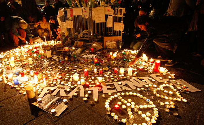 People light candles on a temporary memorial, during a demonstration at the Old-Port, in Marseille, southern France