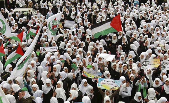 Palestinian students chant slogans during a protest organized by the Islamic Hamas movement in solidarity with the Al-Aqsa Mosque in Jerusalem, at the Palestinian Legislative Council in Gaza City