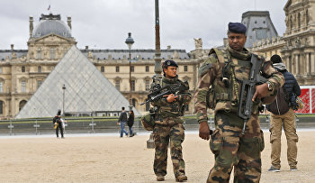 Soldiers patrol in the courtyard of the Louvre Museum in Paris