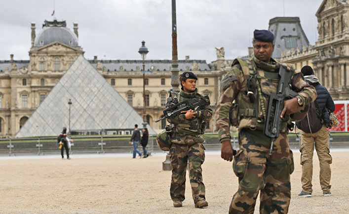 Soldiers patrol in the courtyard of the Louvre Museum in Paris