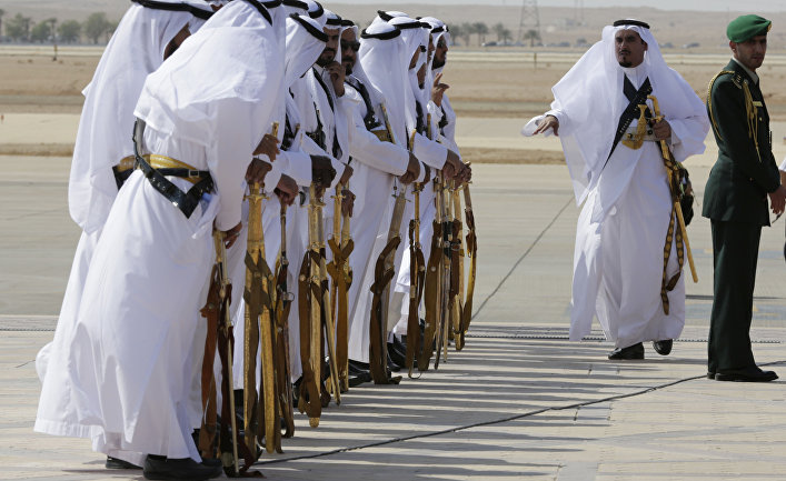 Saudi honor guards wait to welcome guests during their arrival to participate in a summit of Arab and South American leaders in Riyadh, Saudi Arabia