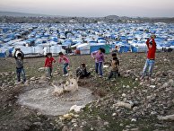 Syrian refugee children play at a temporary refugee camp in Irbil, northern Iraq. Some 240,000 refugees who fled the fighting in Syria now live in Iraq