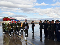 Turkish and Russian military officers salute as a Turkish honour guard carry the coffin of Russian pilot Lt. Col. Oleg Peshkov into a Russian Air Force transport plane at Esenboga Airport in Ankara, Turkey