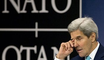 U.S. Secretary of State John Kerry pauses before speaking during a media conference at NATO headquarters in Brussels on Wednesday, Dec. 2, 2015