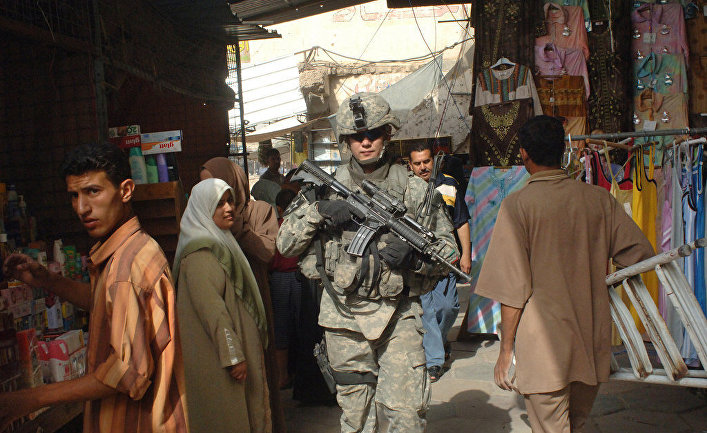 U.S. Army Staff Sgt. Kevin Nettnin conducts a dismounted patrol to assess the progress of security measures in the Al Dora market area of Baghdad, Iraq