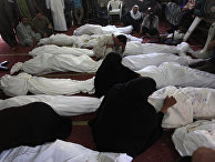 Egyptians mourn over the bodies of their relatives who died in clashes with security forces, in the El-Iman mosque at Nasr City, Cairo, Egypt