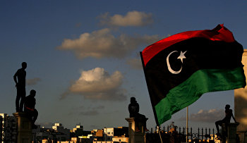 Libyans watch the protest against Ansar al-Shariah Brigades and other Islamic militias, in Benghazi, Libya