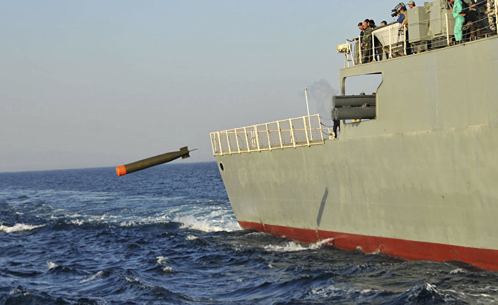 The Iranian Jamaran destroyer launches a torpedo during a maneuver in the Oman Sea in a part of Iranian southern waters.