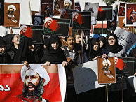 Lebanese students carry portraits of Shiite cleric Sheikh Nimr al-Nimr, a prominent opposition Saudi Shiite cleric who was executed by Saudi Arabia