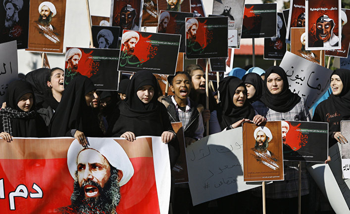 Lebanese students carry portraits of Shiite cleric Sheikh Nimr al-Nimr, a prominent opposition Saudi Shiite cleric who was executed by Saudi Arabia