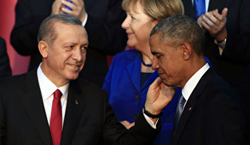President Barack Obama, right, is greeted by Turkish President Recep Tayyip Erdogan as German Chancellor Angela Merkel is seen in background, after posing for a family photo at the G-20 summit in Antalya, Turkey