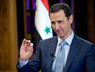 Feb. 10, 2015 file photo released by the Syrian official news agency SANA, Syrian President Bashar Assad gestures during an interview with the BBC, in Damascus, Syria